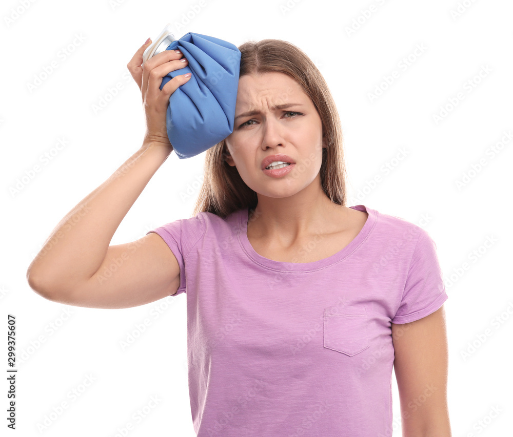 Unhappy woman using cold pack to cure headache on white background Unhappy woman using cold pack to cure headache on white background