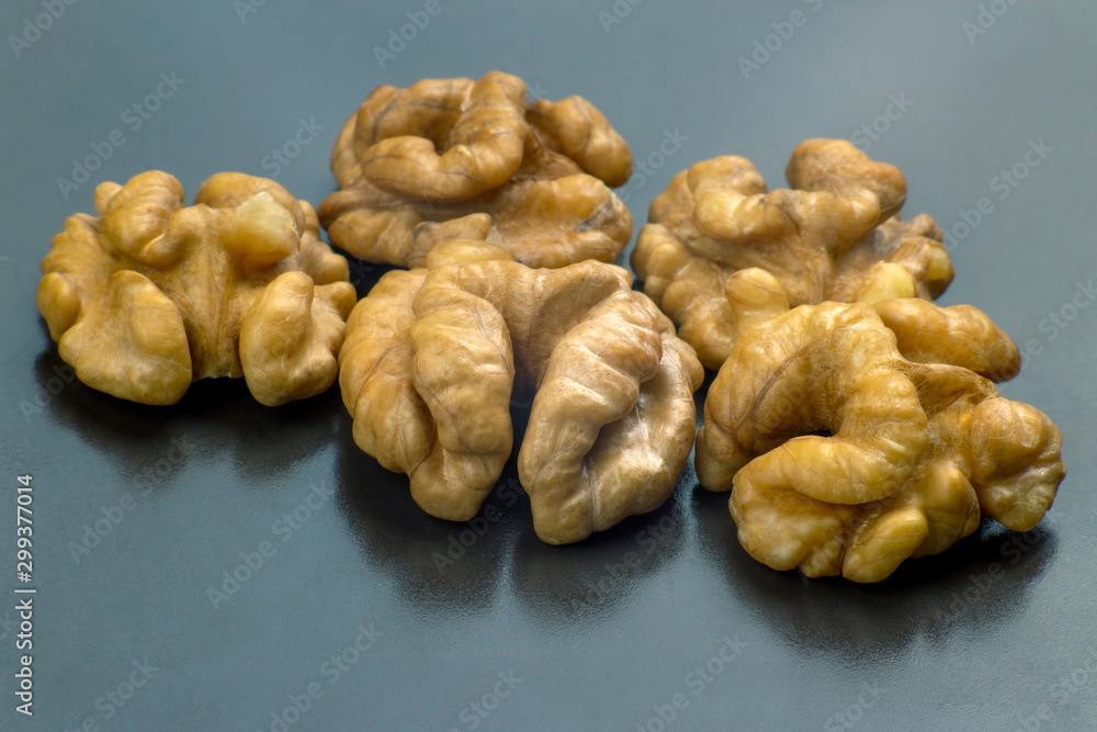 walnuts closeup on gray background. Healthy food and vitamins.