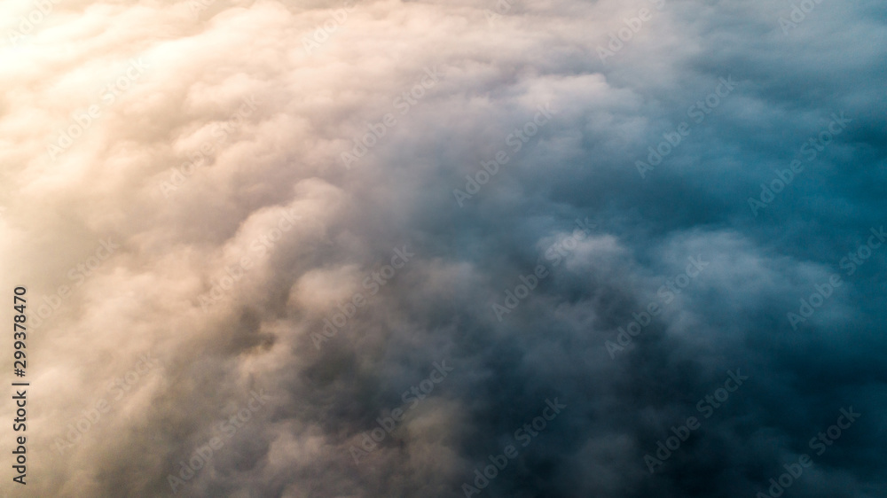 Obraz premium Background from thick morning blue fog with warm backlight from the rising sun.