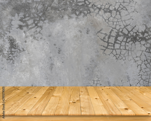 Empty brown old plank wooden board as mock up display shelf with abstract beautiful pattern and textured on flat cement wall in coffee shop and soft lighting background. © Krisda