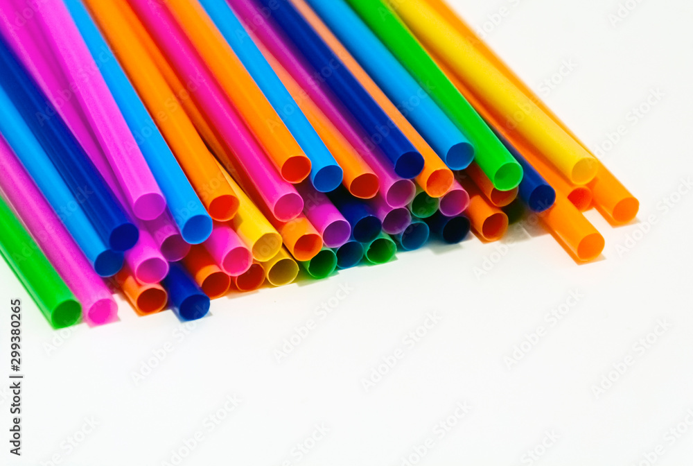 group of plastic straws of various colors on a white background. group of plastic straws of various colors on a white background.