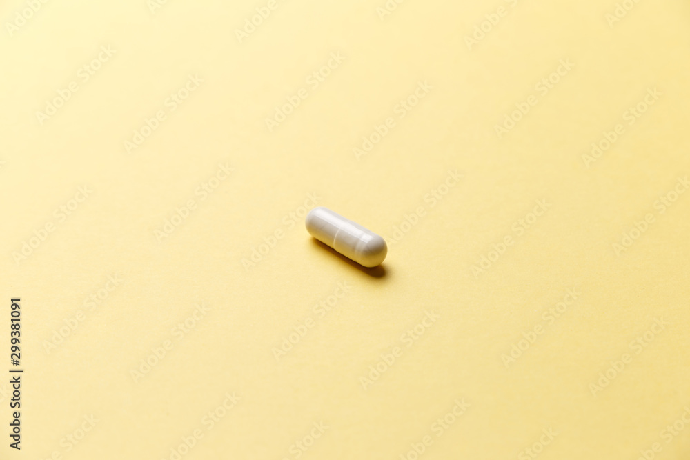 Pharmaceutical medicine pills, tablets and capsules on yellow background. Top view. Flat lay. Copy space. Medicine concepts. Minimalistic abstract concept. Trendy color Pharmaceutical medicine pills, tablets and capsules on yellow background. Top view. Flat lay. Copy space. Medicine concepts. Minimalistic abstract concept. Trendy color