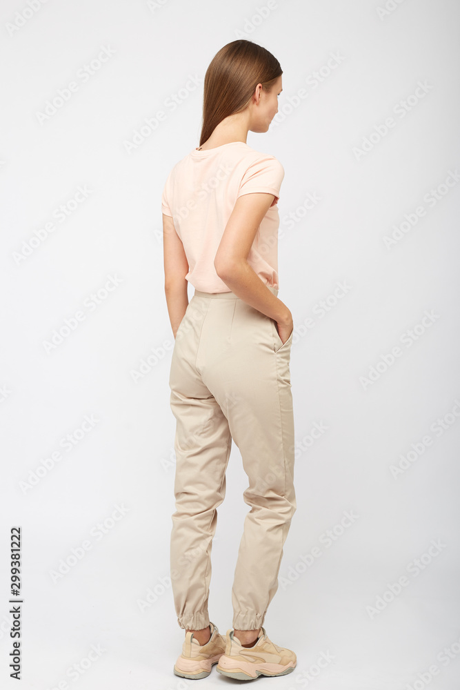 girl in beige cargo pants and a t-shirt girl in beige cargo pants and a t-shirt
