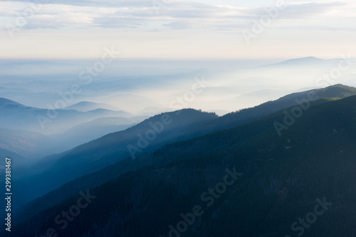 The sun shines through the mountains, Low Tatras, Chopok, central Slovakia