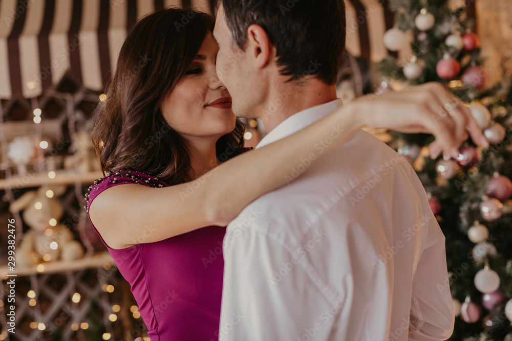 Happy couple celebrating Christmas together . Happy couple celebrating Christmas together .