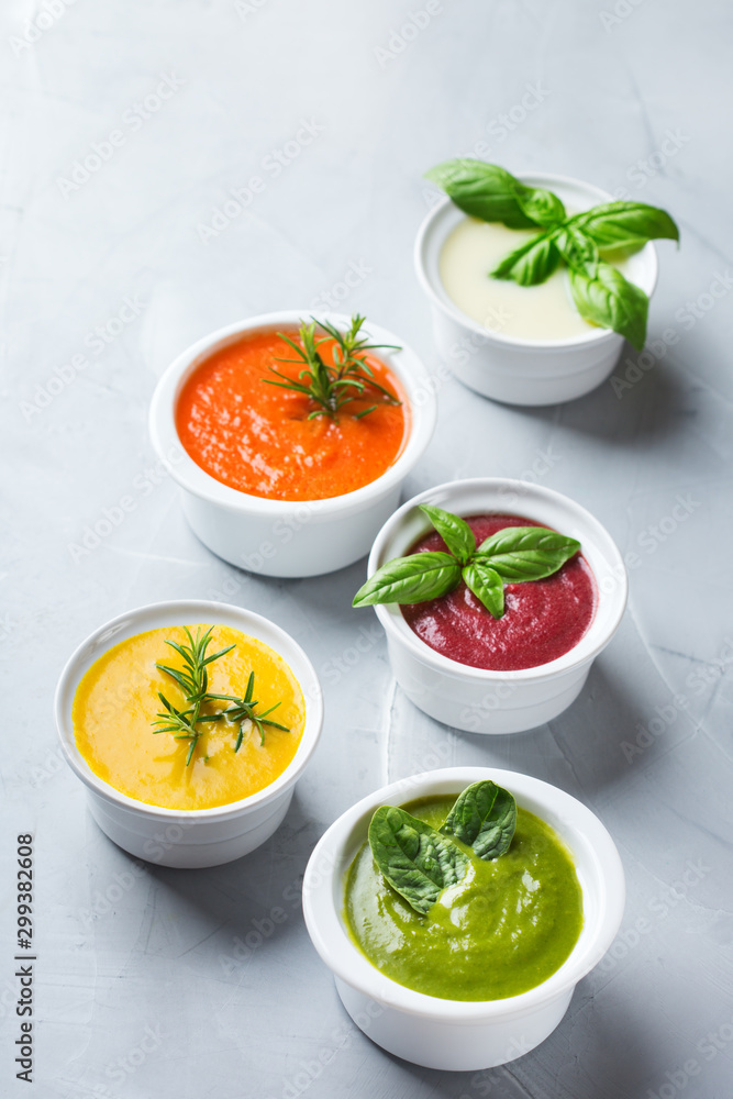 Set of seasonal fall autumn creamy soups on a table Set of seasonal fall autumn creamy soups on a table
