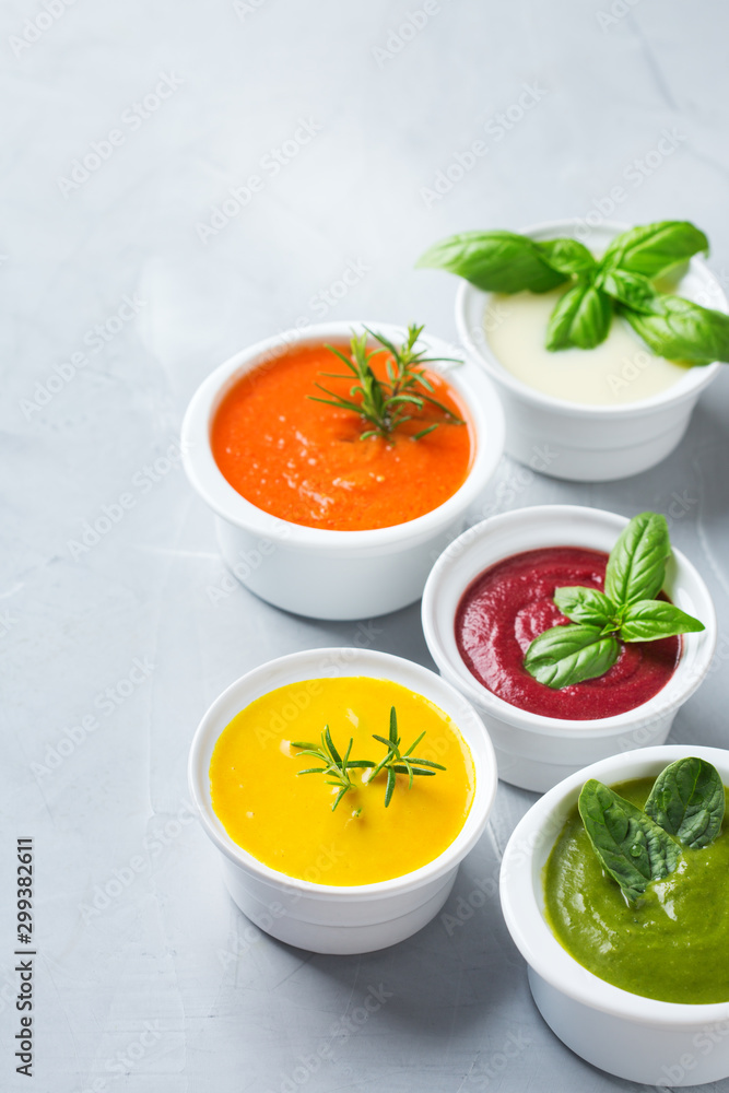 Set of seasonal fall autumn creamy soups on a table Set of seasonal fall autumn creamy soups on a table