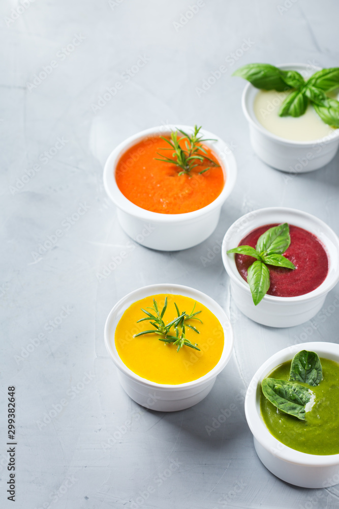 Set of seasonal fall autumn creamy soups on a table Set of seasonal fall autumn creamy soups on a table