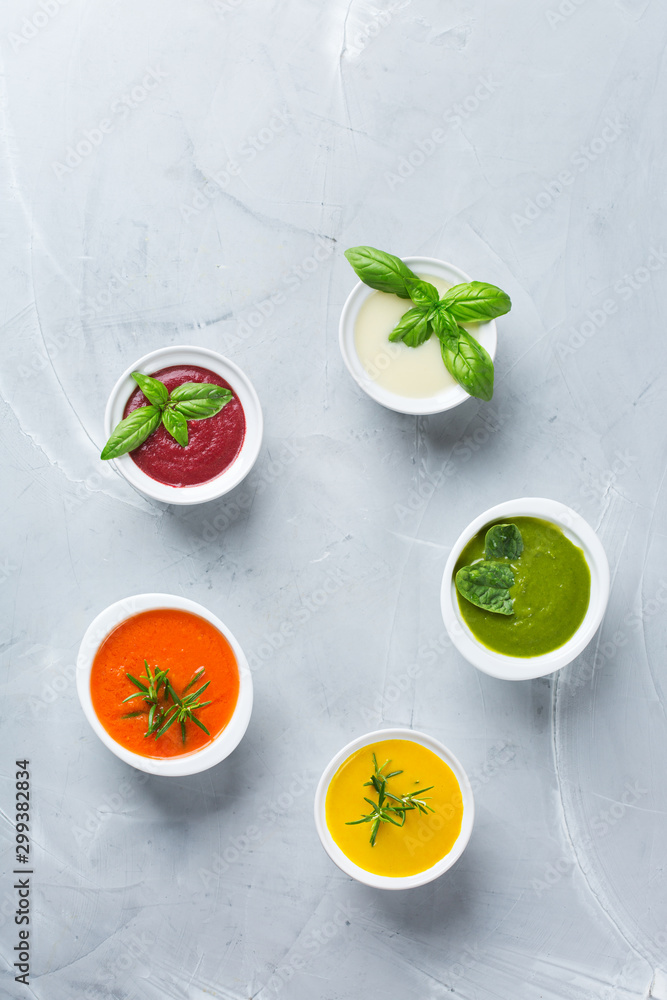 Set of seasonal fall autumn creamy soups on a table Set of seasonal fall autumn creamy soups on a table