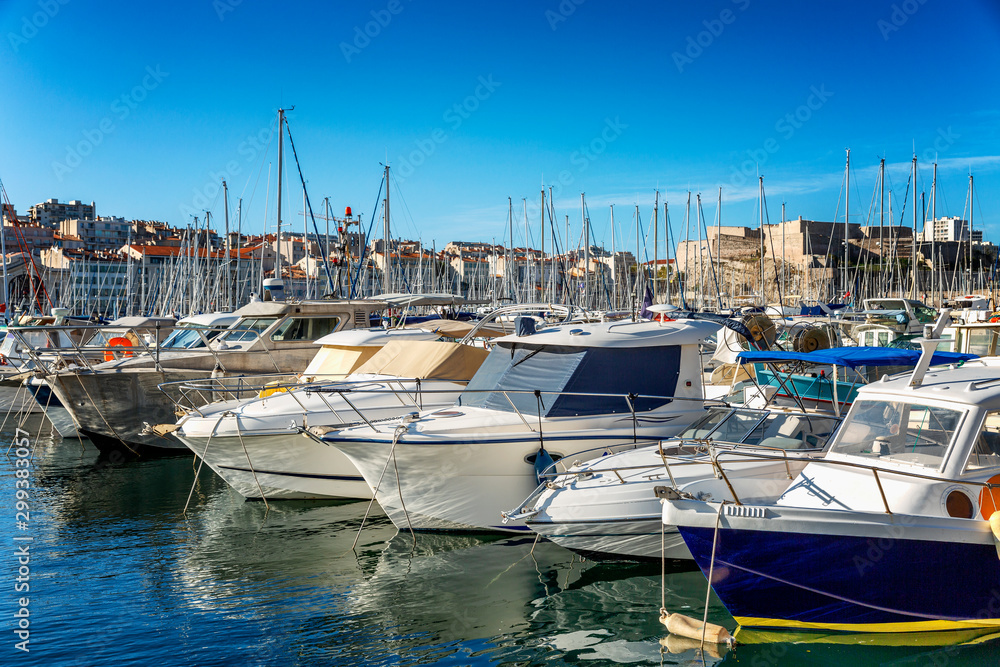 Snow-white yachts in the marina of Marseille on a bright sunny day. Beautiful landscape.