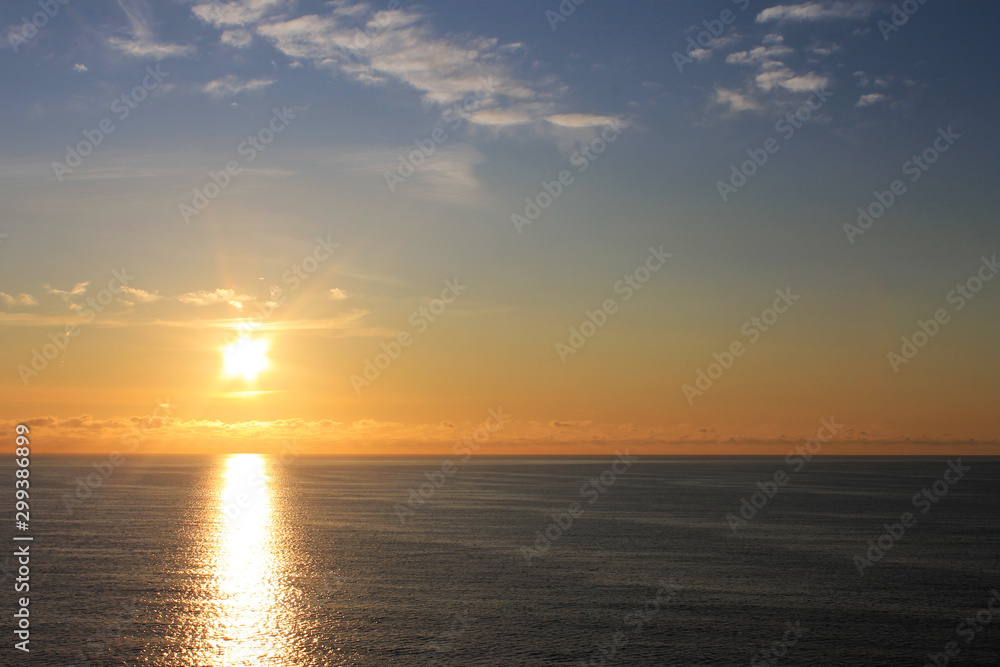 sunrise over the Atlantic ocean, view from the deck of a ship.