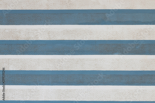 Fotografi Front view of blue and white striped wall surface