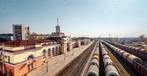 Railway station and trains with oil tanks.in Yoshkar-Ola city in sunny day, top view. Inscription on the station building: Yoshkar-Ola. Mari El, Russia photo