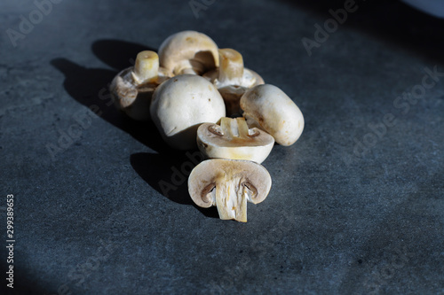 champignon mushrooms on gray table background photo