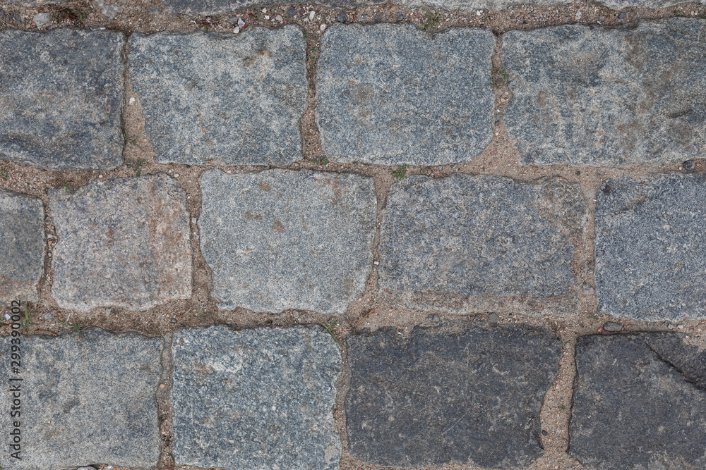 Grey masonry on street, background with grunge texture Grey masonry on street, background with grunge texture