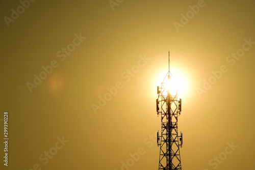 Wireless telephone pole and sunrise orange-yellow sky In the early morning of the day 