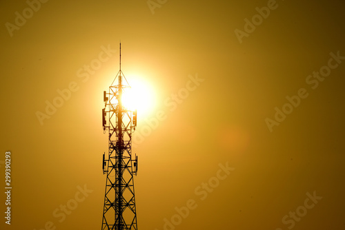 Wireless telephone pole and orange-yellow sky In the early morning of the day 