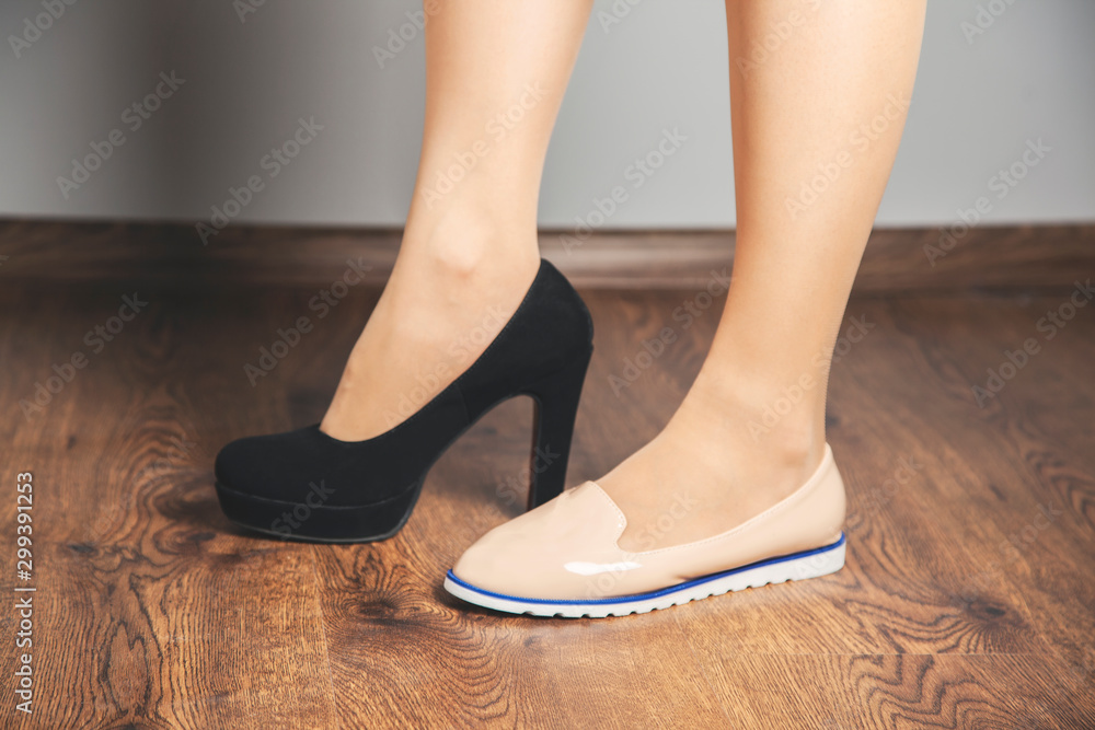 woman foot high and low shoes