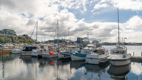 Fishing boats in Torshavn harbour on Faroe islands. © CanYalicn