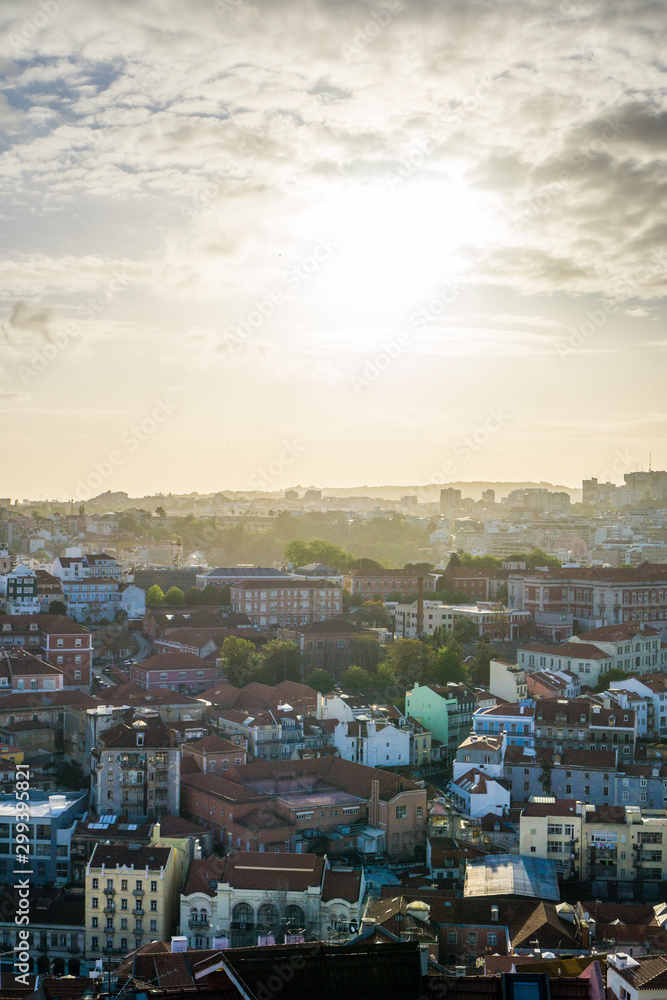 Fototapeta premium An amazing panoramic view of the city of Lisbon from the Miradouro da Senhora do Monte during sunset time.