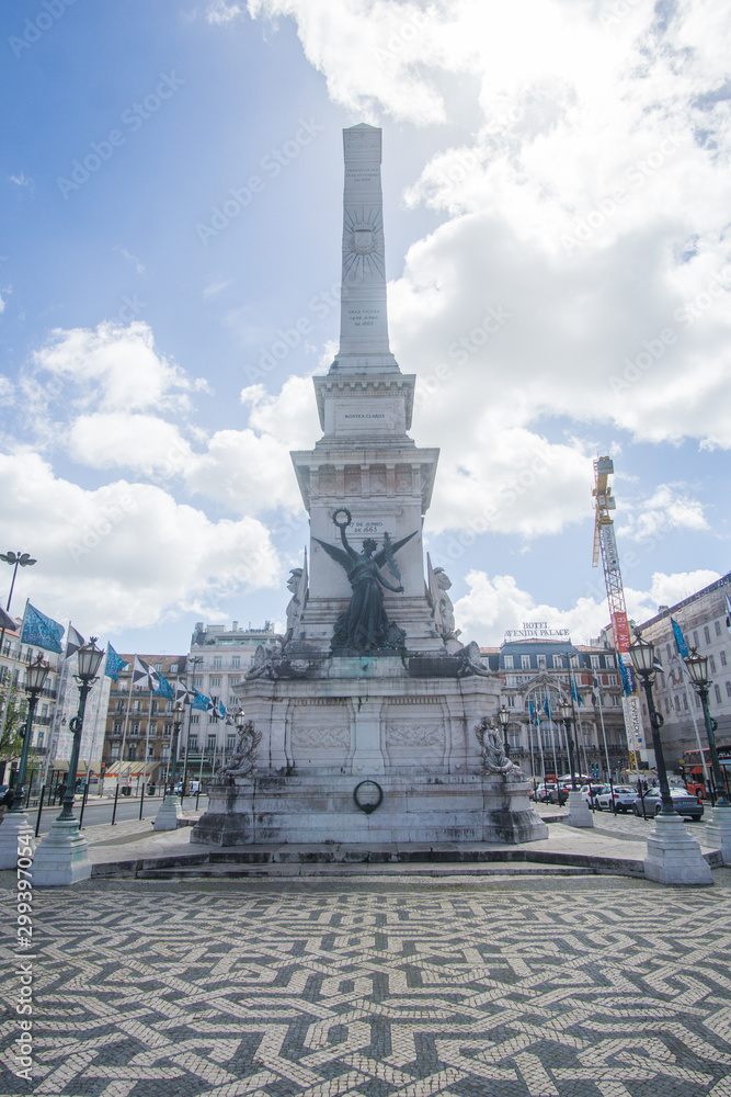 The Monumento aos Restauradores statue in Restauradores square in Lisbon city , Portugal 