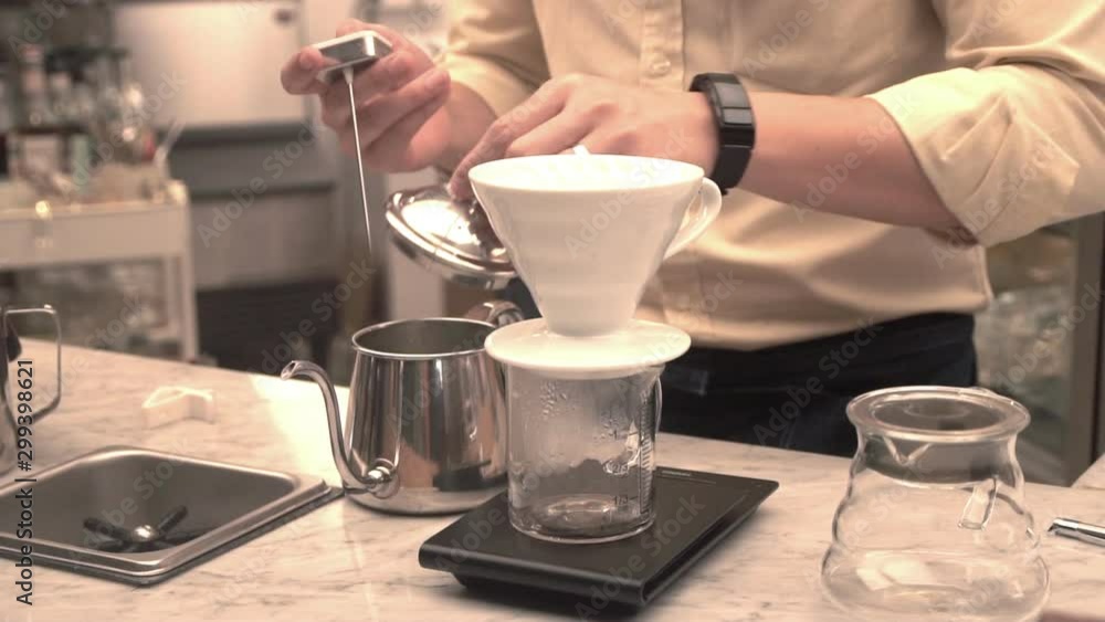 Barista dipping Coffee,Pour the hot water in the coffee filter paper. Barista dipping Coffee,Pour the hot water in the coffee filter paper.
