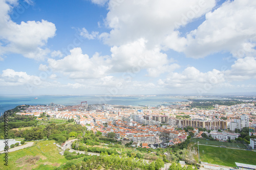 Panoramic view of the Tagus river and the buildings of Almada , this picture was captured from the National Sanctuary of Christ the King  statue in Lisbon , Portugal .  © Ben
