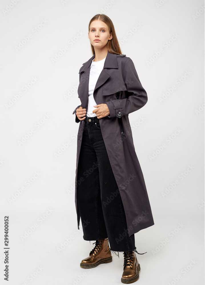 Female trench coat. Charcoal color. Isolated on white background.