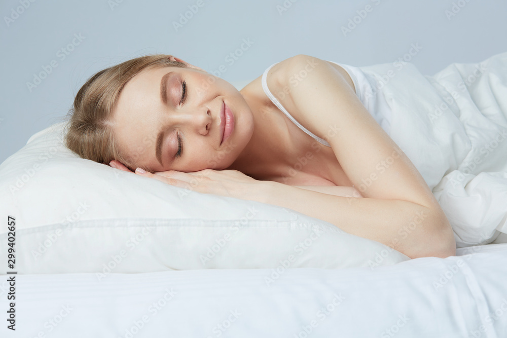 Young beautiful girl sleeps in the bedroom Young beautiful girl sleeps in the bedroom