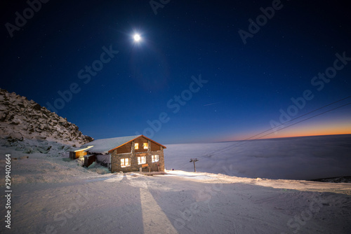 Kamenna Chata - Chopok, Nizke Tatry, Cottage on the top of a mountain, Above the clouds in winter photo