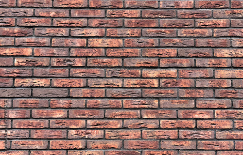 A wall of red  old brick. Background  texture and concept.