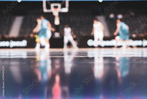 blurred background of basketball players on court during game - very shallow depht of field