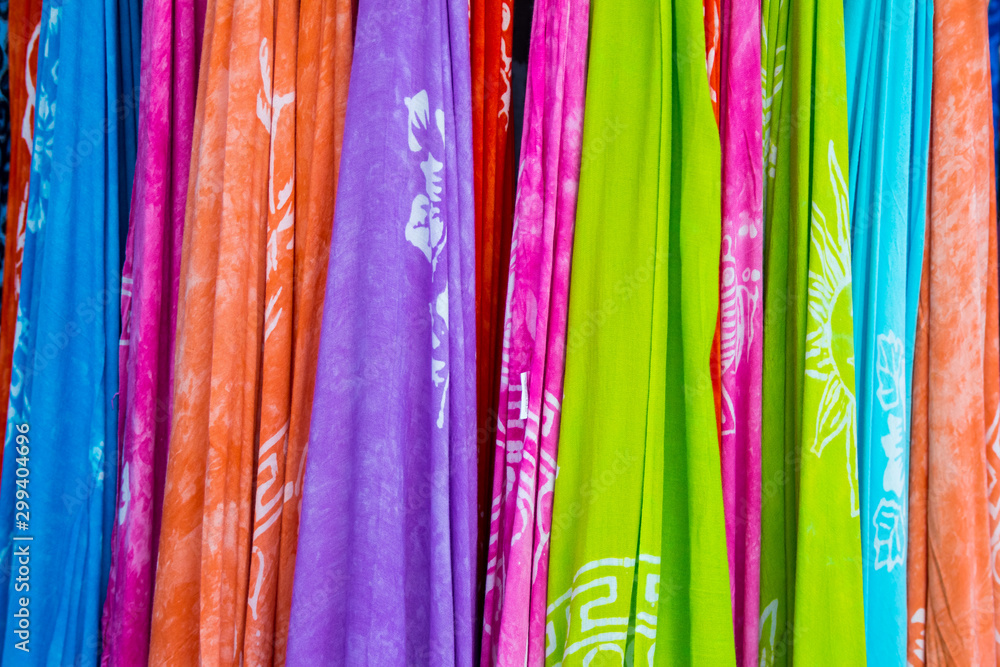 Colorful fabrics displayed in street shop