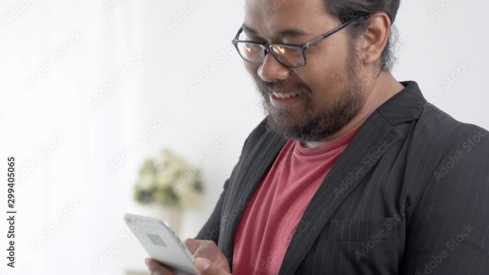 happy excited entrepreneur raised his arm success gesture chasing his goal while using mobile phone happy excited entrepreneur raised his arm success gesture chasing his goal while using mobile phone