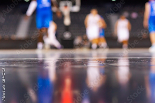 blurred background of basketball players on court during game - very shallow depht of field