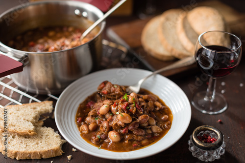Hearty Bean Stew with Meat and Pepper in White Plate