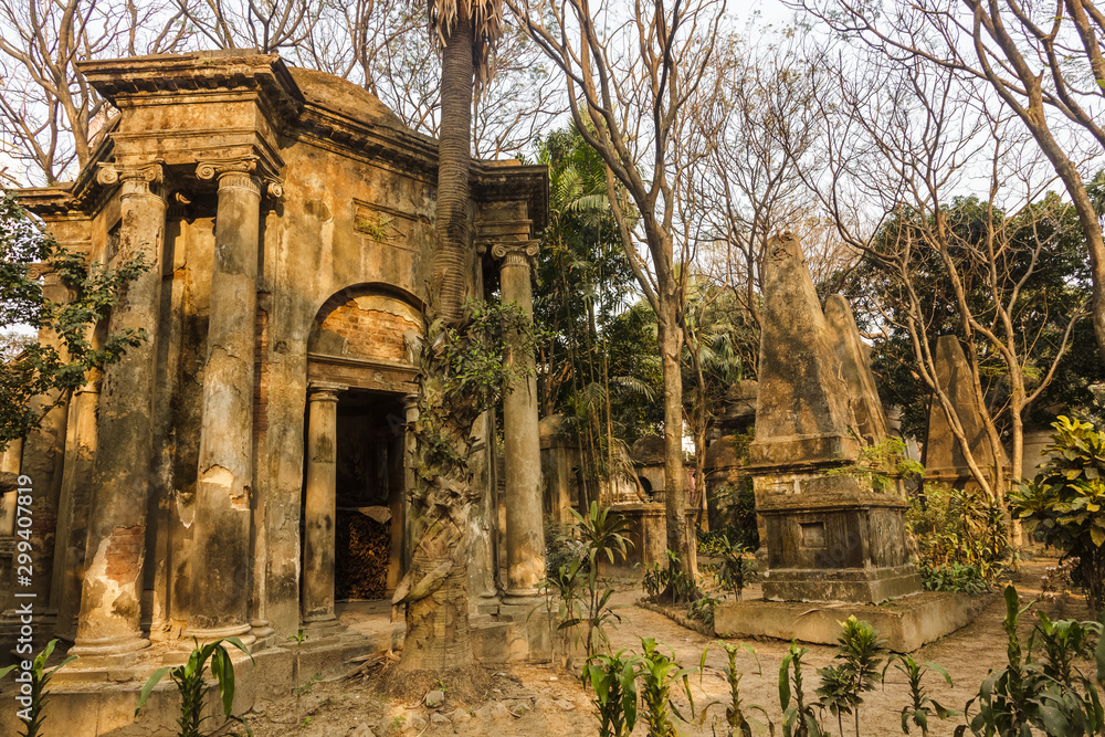 Kolkata, West Bengal/India - January 26 2018: The gothic, Indo-Saracenic tombs built in the 19th century surrounded by trees inside the South Park Street cemetery.