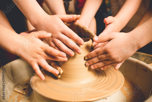 Children s hands make a mold of clay. Pottery