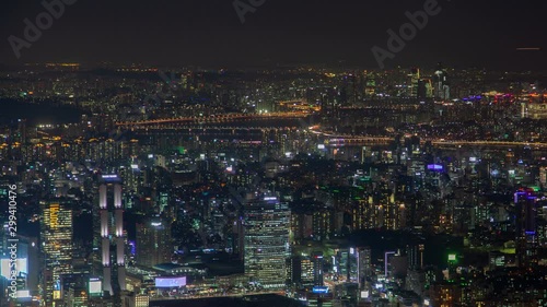 Wallpaper Mural Timelapse flashing advertisements on large Seoul building displays among illuminated city with highways panning up Torontodigital.ca