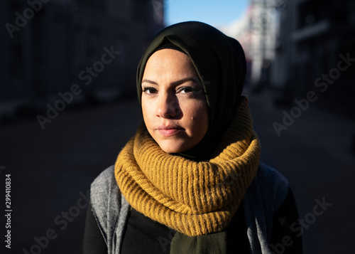 Portrait of a young woman wearing headscarf in the sunshine