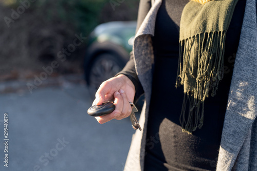 Bilde på lerret Person's hand unlocking the car with remote control