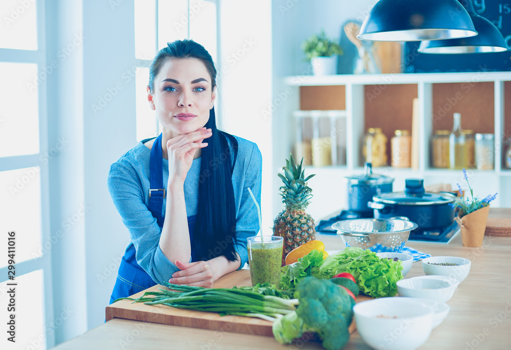 Young with with basket of fresh vegetables in the kitchen Young with with basket of fresh vegetables in the kitchen