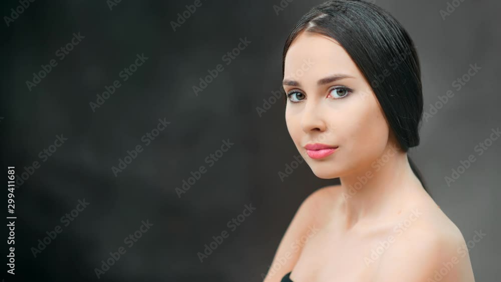 Portrait of fresh charming sexy young naked girl posing at black studio background medium close-up Portrait of fresh charming sexy young naked girl posing at black studio background medium close-up