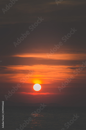 dramatic orange sunset by the sea