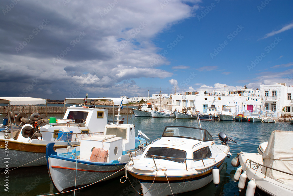 Greece – Paros island :  The pretty village of Naoussa. Small pleasure and fishing craft at harbor on a summers day.