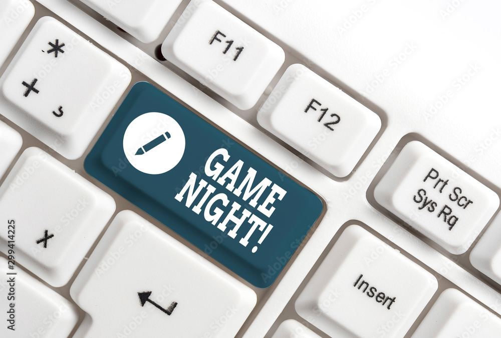 Conceptual hand writing showing Game Night. Concept meaning usually its called on adult play dates like poker with friends White pc keyboard with note paper above the white background Conceptual hand writing showing Game Night. Concept meaning usually its called on adult play dates like poker with friends White pc keyboard with note paper above the white background