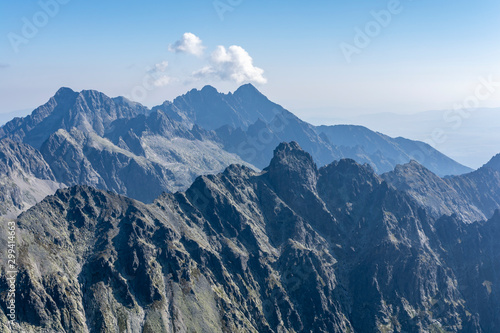 Beautiful landscape on a sunny day in the mountains. View of the mountain ridges in the morning. Tatra Mountains.