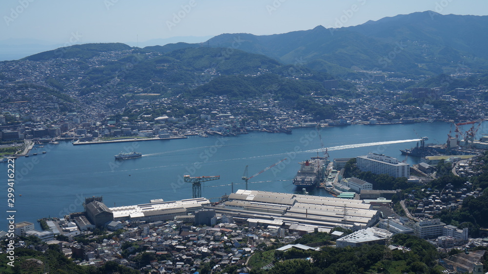 Aerial panoramic view to the seaport in Nagasaki city from the mount Inasa observation platform, Kyushu, Japan.