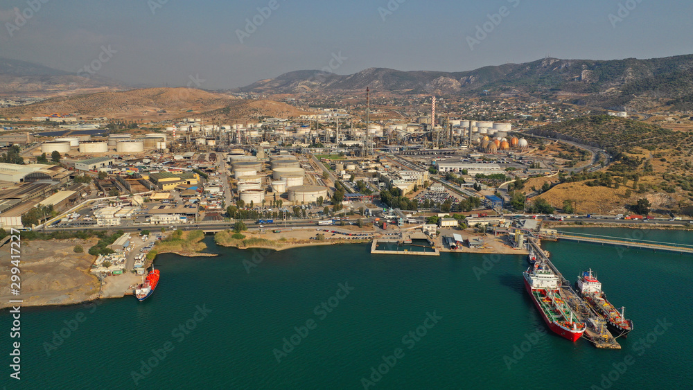 Obraz premium Aerial drone photo of industrial refinery of Hellenic Public Petroleum company in gulf of Aspropirgos, Attica, Greece