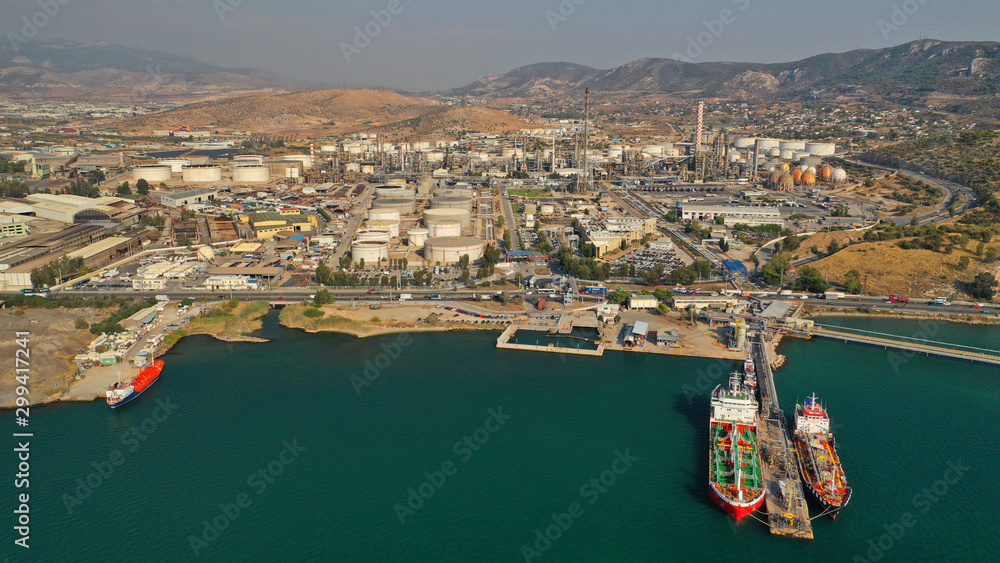 Fototapeta premium Aerial drone photo of industrial refinery of Hellenic Public Petroleum company in gulf of Aspropirgos, Attica, Greece